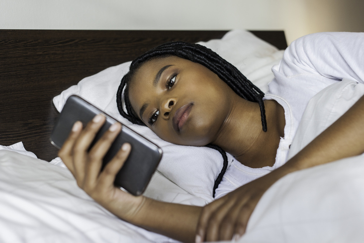 Beautiful businesswoman waking up in the morning before work during daylight saving time