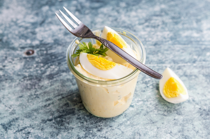 Egg salad in a glass with a fork