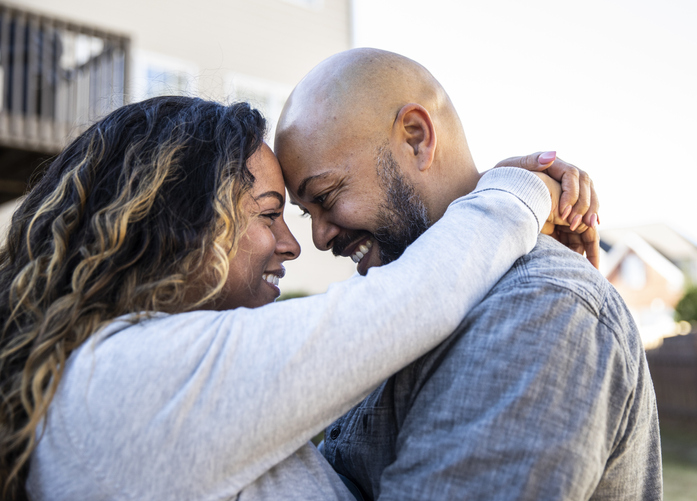 Husband and wife in front of home, Black Wife effect