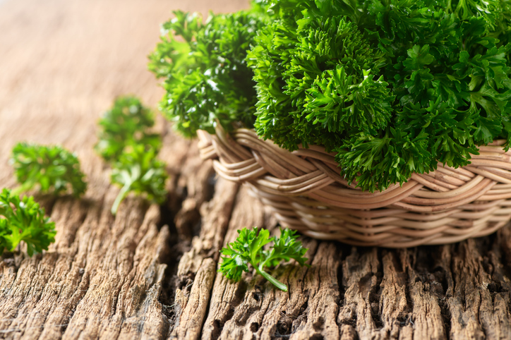 Close-Up Of Parsley Leaves In Basket On Table