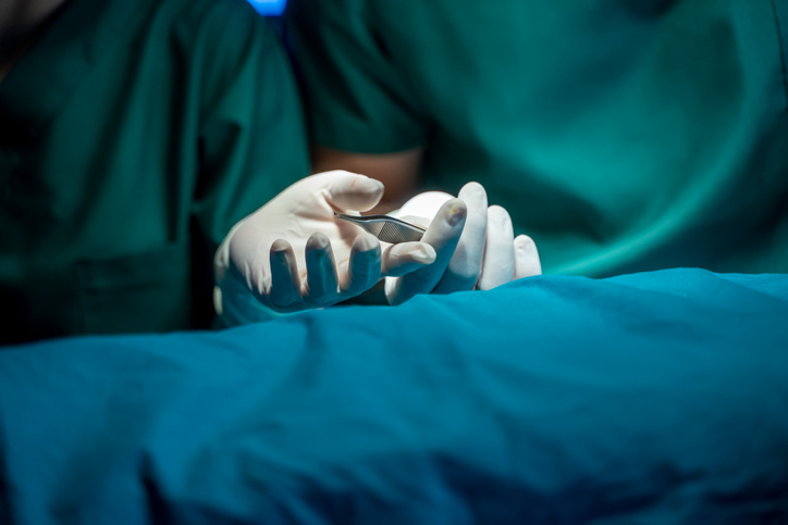 Close Up Hand Surgeon With Scalpel In The Operating Room At Hospital.