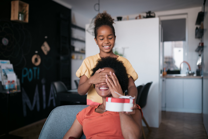 African American mother and daughter celebrating mother's day at home