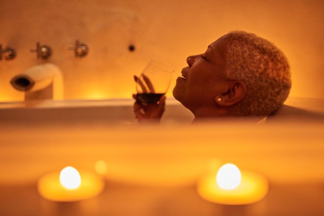 Mature woman relaxes in bath