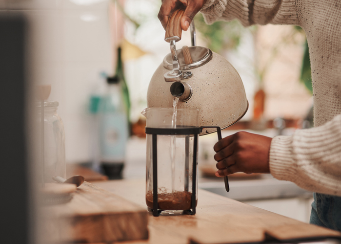 Shot of an unrecognizable person making coffee at home