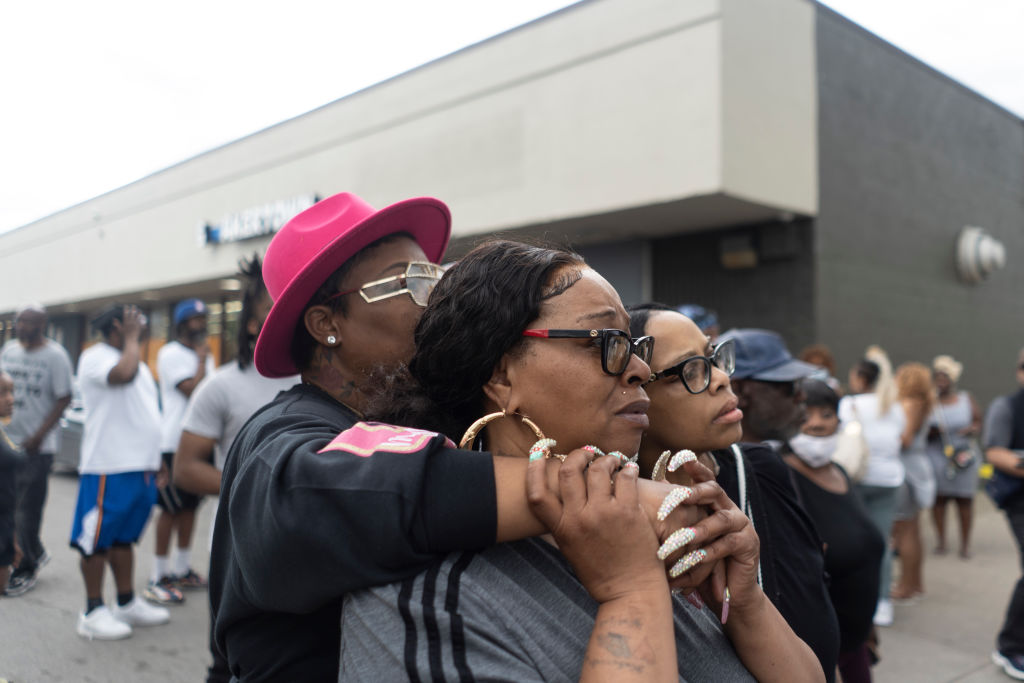 BUFFALO, NY - MAY 14: People watch the crime scene of an active
