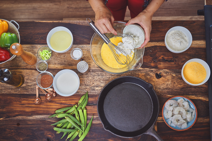 Preparing Cajun Style Chicken, Shrimp and Sausage Jambalaya in a Cast Iron Pot