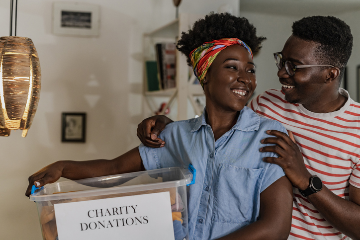 Young couple enjoying charity work at home