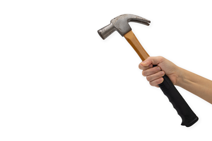 Cropped Hand Of Woman Holding Hammer Against White Background