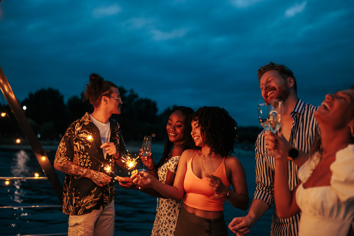 Group of multiracial friends at boat party