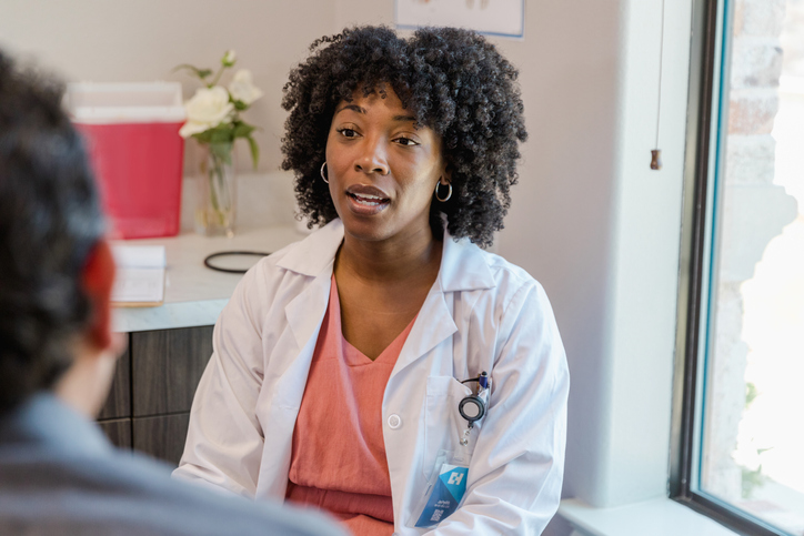 Doctor and patient discussiong common cancers