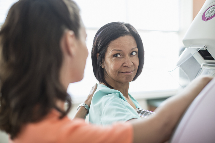 Nurse preparing patient for a mammogram