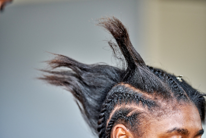 A close up of incomplete braided hair