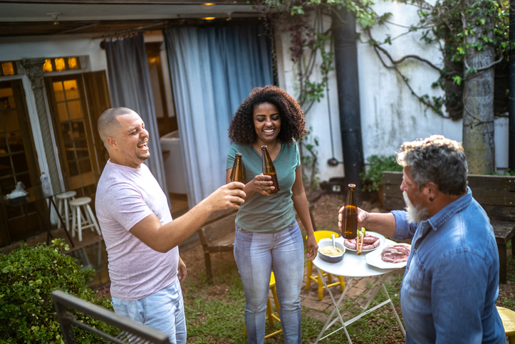 Family toasting on a barbecue at home