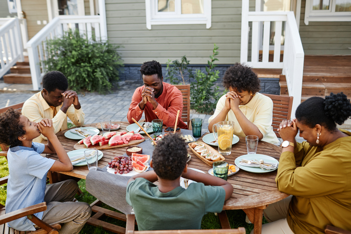 African American Family Saying Grace feeling grateful