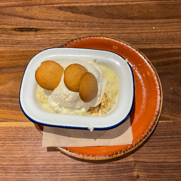 Banana pudding with whipped cream and wafers