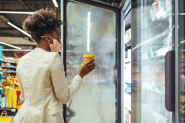 Businesswoman reading label before buying