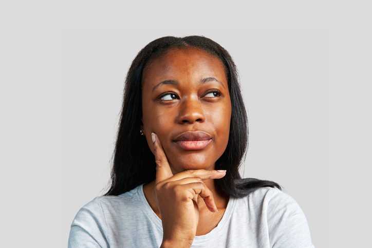 Close up photo of an african woman considering life lessons