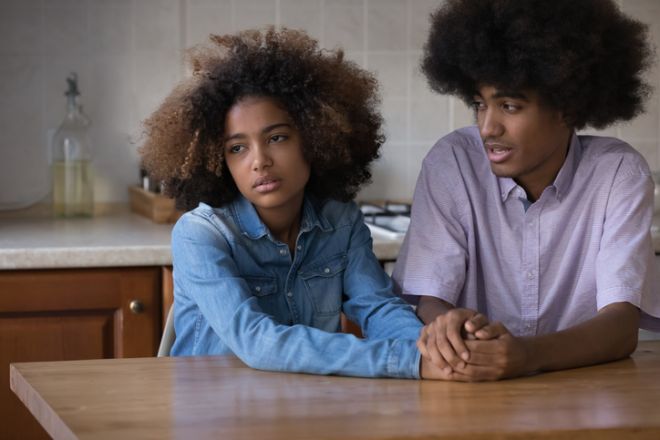 Teen loving Black guy giving comfort, support, compassion to girlfriend