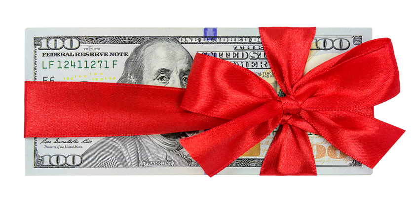 One hundred dollar bills like a gift isolated on white