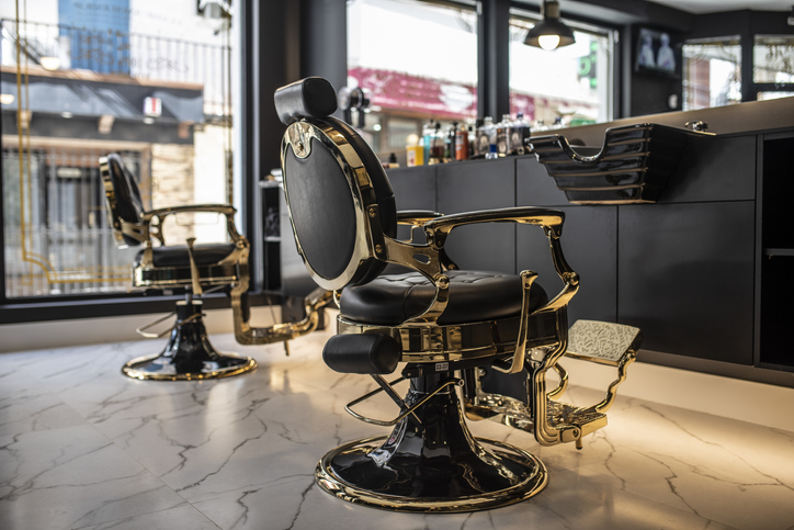 Empty barberia chairs waiting for clients for shaving and haircut, barber shop indoors