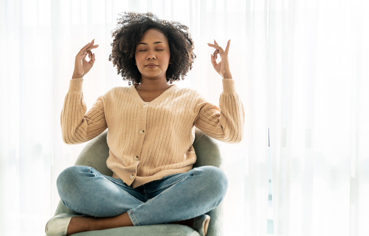 Portrait of young African American black woman doing yoga moves or meditate ,girl start her yoga with meditation. Sport healthcare relax, peace of mind concept