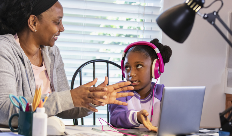 Grandmother helping granddaughter in special education study at home