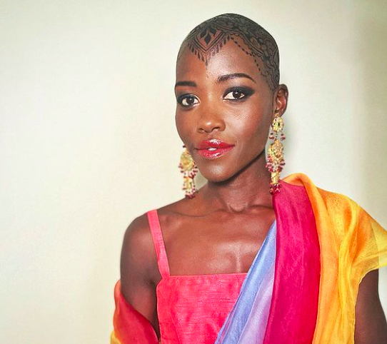 Lupita Nyong'o Jugua stained bald baldie Indian wedding henna ink