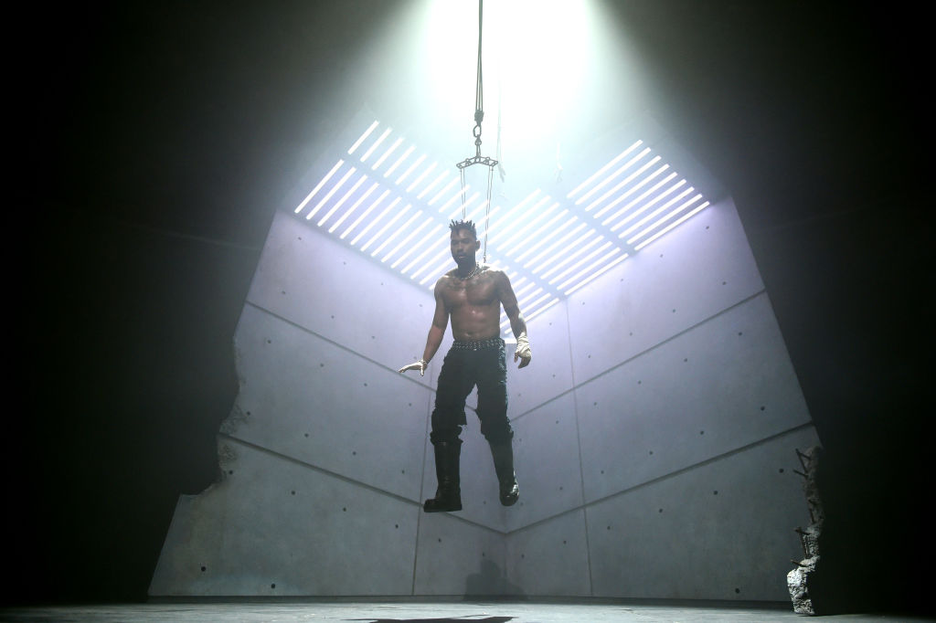 Miguel body suspension concert metal hooks Instagram pain ritual worship