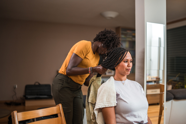 Hairstylist Working with Client at Home