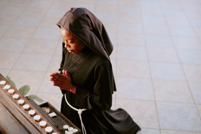 African American Nun Praying In Church, Bishop James V. Johnston, Sister Wilhelmina Lancaster, Queen of Apostles, Benedictines of Mary, decomposition