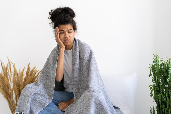 Stressed African American girl having painful face expression