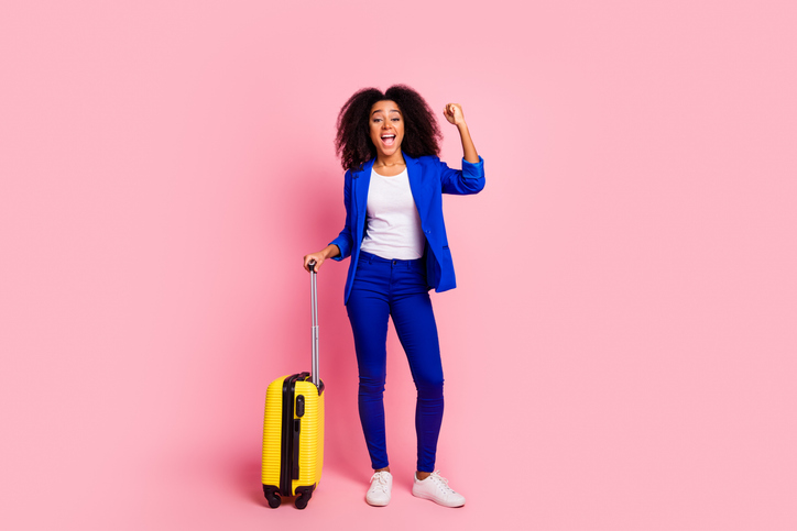 Photo of cheerful glad charming girl wear trendy blue clothes raise hand fist isolated on pink color background