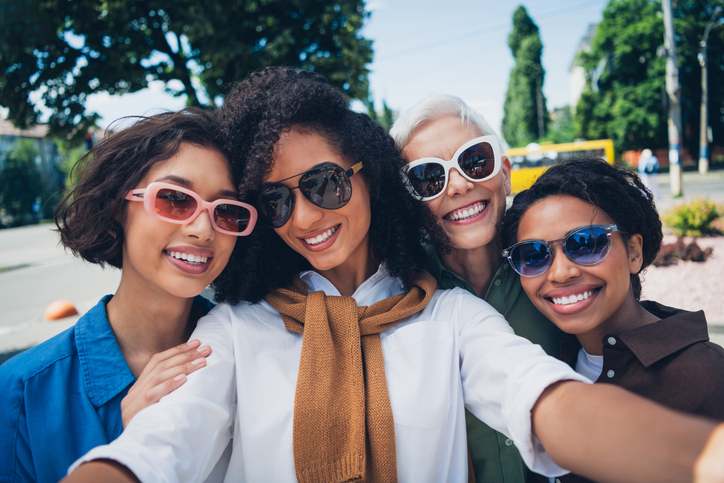 Portrait of group friends women embrace make selfie pastime weekend walk city center park outdoors