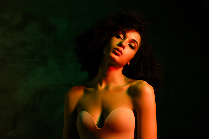Photo of seductive dreamy woman naked shoulders enjoying self acceptance empty space isolated concrete green color wall
