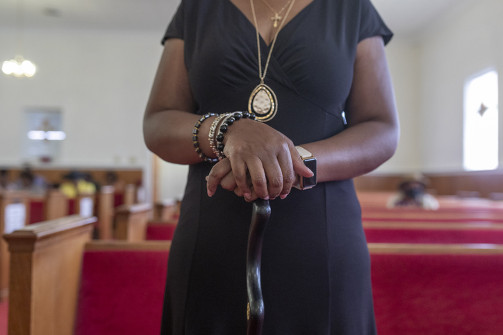 Elegant Worshipper Clasping Hands in Church
