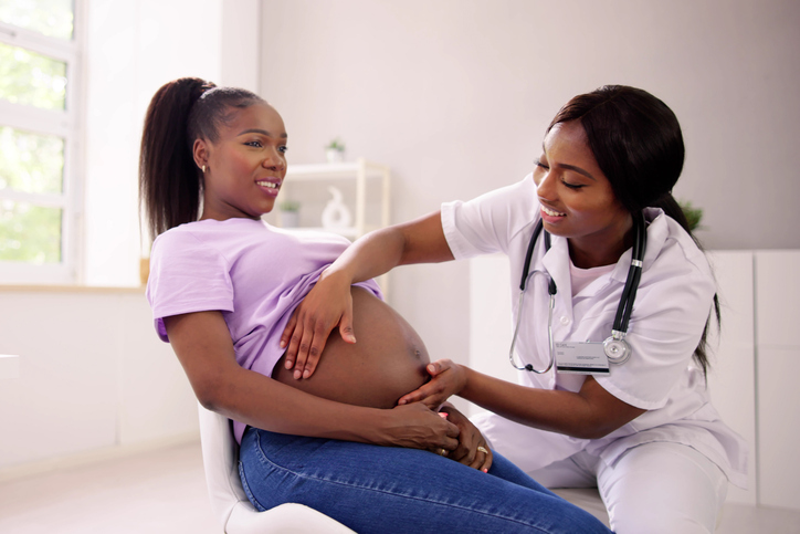 Pregnant Woman Massage By Doula. Baby Care