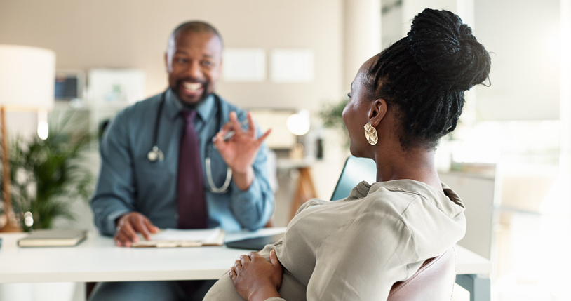 Healthcare, okay or pregnancy with doctor and patient in office at hospital for consulting or positive feedback. Gesture, smile and medical professional man talking to pregnant woman in clinic