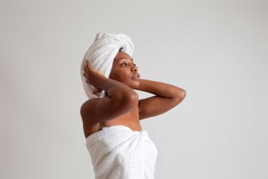 Black woman wrapped in a bath towel