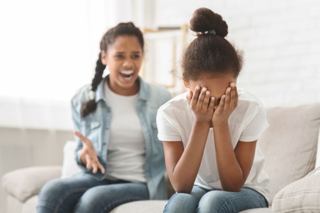 African sisters fighting at home, bullying concept