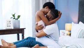 Shot of a young couple being intimate in bed at home
