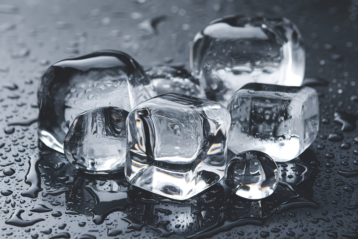 Clear,Translucent ice cubes placed on a black surface