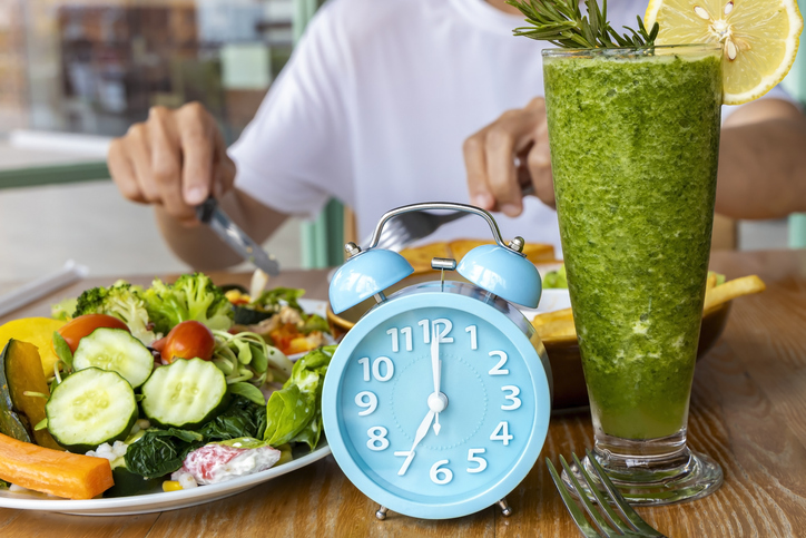 Alarm clock with IF (Intermittent Fasting) 16 and 8 diet rule and weight loss concept.-Diet plan concept