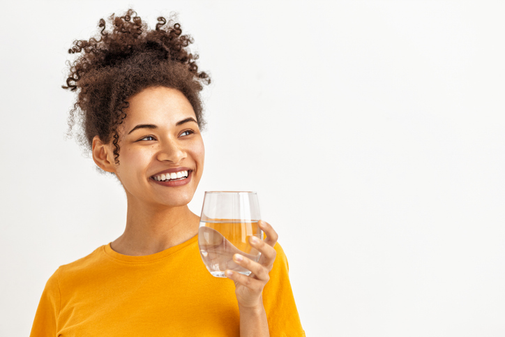 Happy Woman Drinking Water on white background