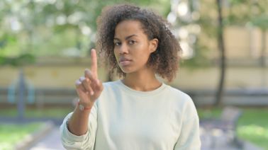 Outdoor Portrait of Rejecting Young African Woman in Denial