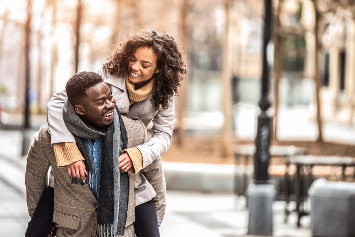 Happy young couple having fun in the city.