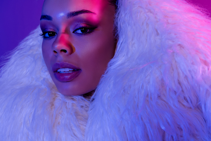 Photo of seductive stunning woman dressed fluffy coat enjoying night event isolated violet color background