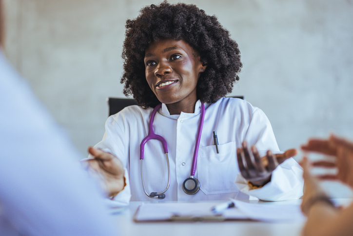 Friendly Doctor Engaging in a Consultation with Patients