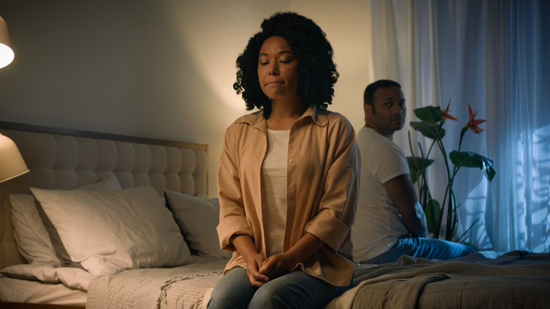 Couple family relationship problem conflict misunderstanding quarrel silence avoid separated African American woman wife girlfriend suffer sad husband boyfriend abuse frustrated sitting on bed night