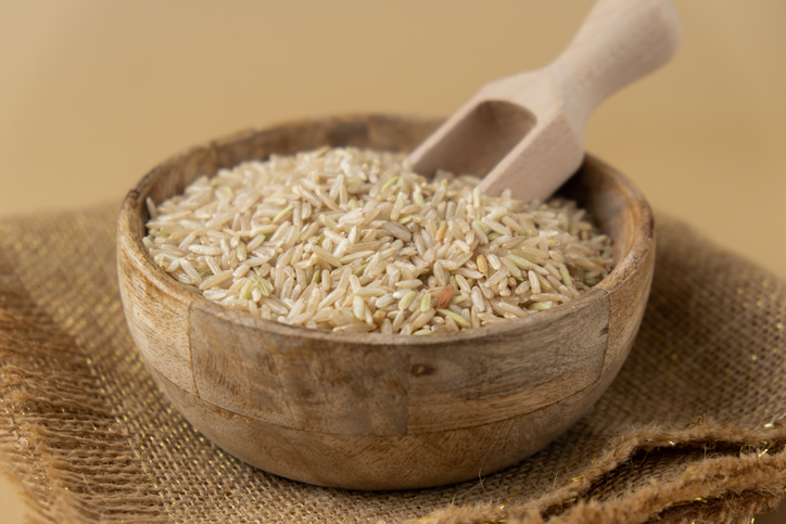 Raw brown rice Gluten free cereals. Health gut benefits. Concept of alternative whole spelt grain ingredient. Vegetarian diet recipes. Plant-based lifestyle. Copy space Protein rich