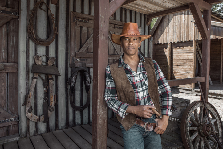 Handsome Black Cowboy in an authentic wild west setting
